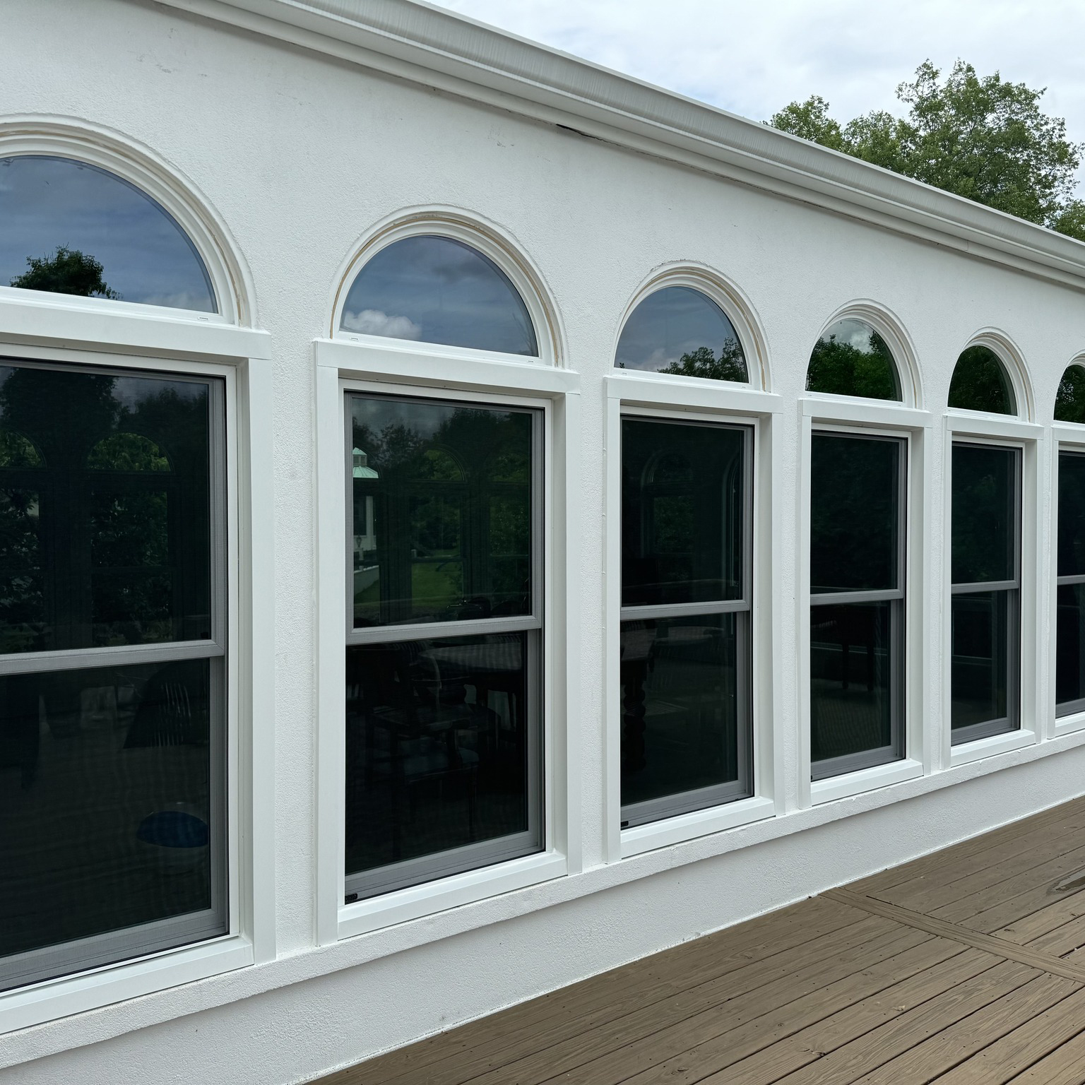 About Skylight Windows, Doors Roofing, your Expert Window And Door Replacement in Nashville, TN, Window specialist measuring and aligning premium frame components for precise installation