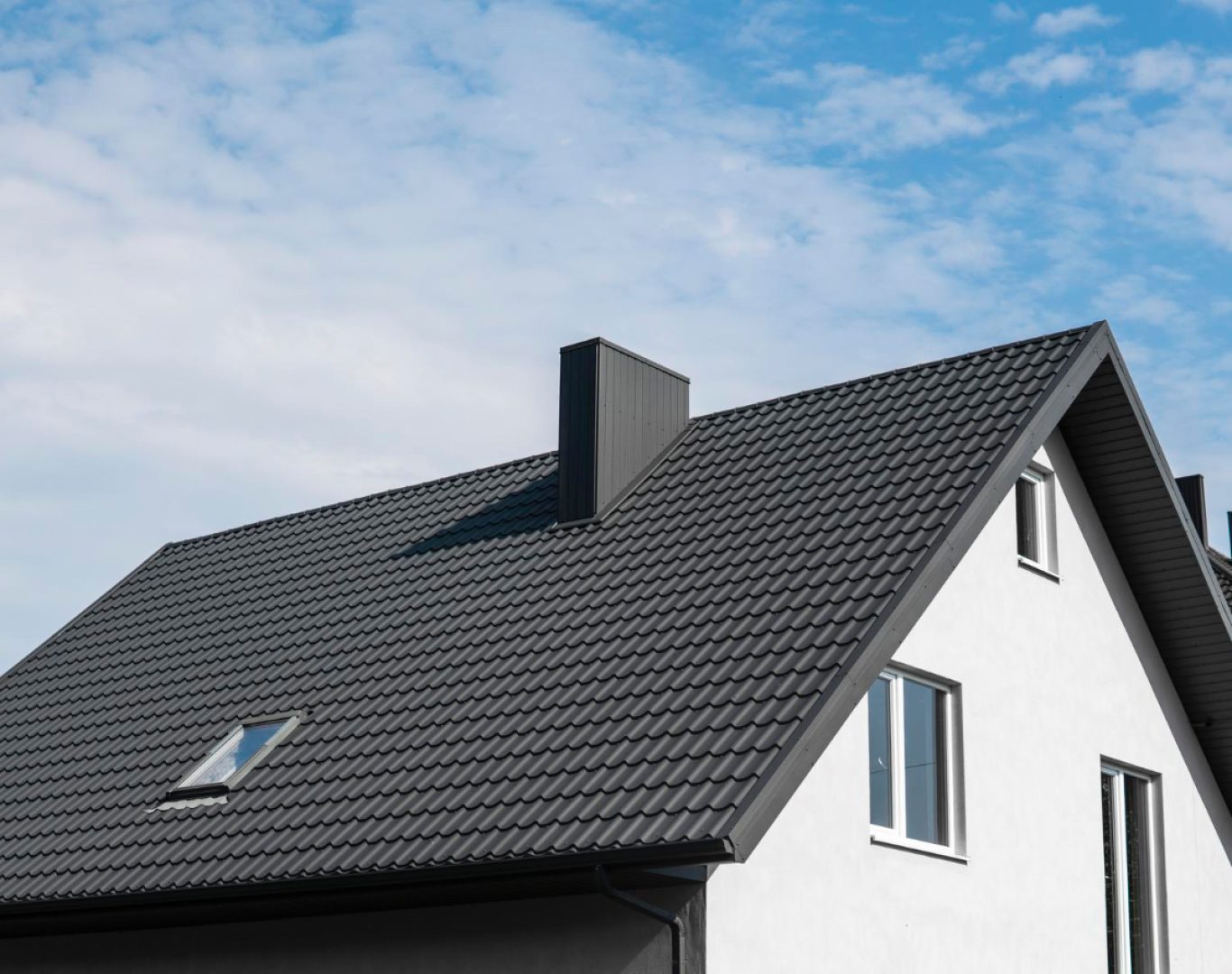 Roofing Replacement in Nashville, TN, Family enjoying brighter living room after new energy-efficient window installation in Brentwood home, Roofing crew replacing worn shingles on large Brentwood residential roof, Homeowner enjoying brighter living room after new energy-efficient window installation